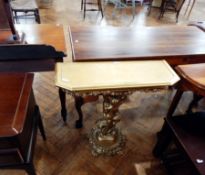 A gilt console table with inset glass top, with floral border apron with putto support,