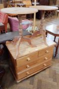 A pine chest of drawers with two short and two long and two pine tripod tables