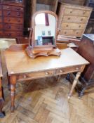 A Victorian mahogany side table with raised back, two frieze drawers, on turned legs,