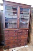 A Victorian mahogany library bookcase with two sets of five graduating drawers,