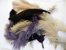 A vintage black straw hat, trimmed with feathers, a Victorian black parasol,