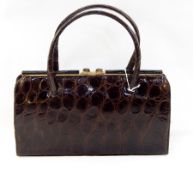 1950's brown crocodile handbag, fixed frame, suede lined interior, labled 