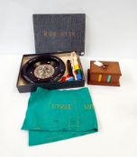 A roulette wheel with tokens and base