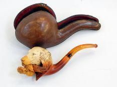 Meerschaum and amber pipe, the bowl carved with hunting dog holding game,