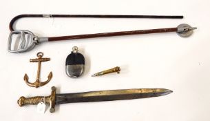 A hip flask, brass anchor, a brass shell, swagger stick,