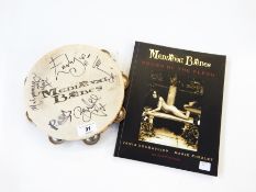 A signed Medieval Babes tambourine and a Medieval Babes Songs of the Flesh