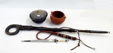 African carved hardwood walking stick with mask and loop handle, African dagger, leather whip,