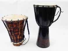 Two small hand drums,