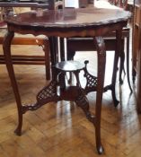 Stained wood coffee table on cabriole legs with basin support to bottom
