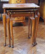 Nest of three burrwood occasional tables on cabriole legs with pad feet,