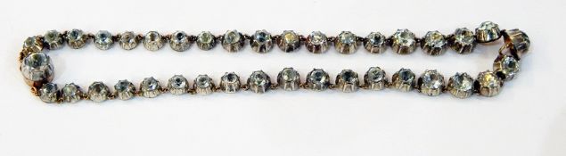 19th century gold-coloured metal and paste stone set necklace having graduated old cut stones in