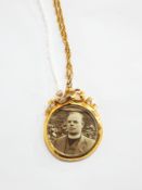 Edwardian 9ct gold open-faced, double-sided locket pendant, ribbon surmount flanking suspension,
