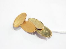 Pair of 9ct gold oval chain link cufflinks, engine-turned and plain, 4g approx.