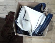 Two floral cushions in red and gold weaving and matching throw,