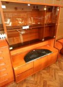 A similar contemporary glazed bookcase with cupboards below,