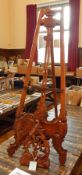 Carved hardwood artist's easel with adjustable slide,