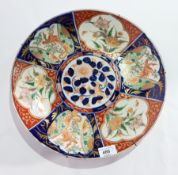 Pair Japanese Imari porcelain plaques, each circular with underglazed blue and iron-red ground,