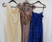 A 1950's mauve satin evening gown with heavily embroidered bodice with sequins and a matching stole,