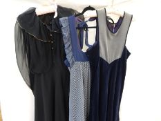 A 1970's Gina Fratini cotton pinafore maxi dress in blue with frills and a tie to the neck,