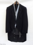 A gentleman's morning suit including grey waistcoat and black cummerbund, striped trousers, made