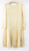 A 1920's chiffon dress with drop waist, embroidered detail with sequins and faux-pearls
THIS LOT