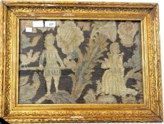 An 18th century(?) woolwork picture showing a gentleman and lady, he appears to be holding a pole