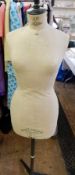 A dressmaker's dummy labelled 