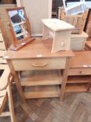 A pine side unit with one long drawer and two lower shelves, on block supports,