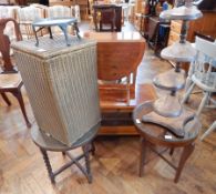 A drop-leaf table with two lyre end supports united with a turned tapering stretcher,