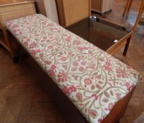 A smoked glass top square coffee table with under-tray, on half moon shaped supports,