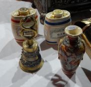 A Satsuma vase with oriental decoration with men in traditional dress,