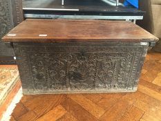 Early 18th century carved fruitwood chest, plain top with moulded edge,