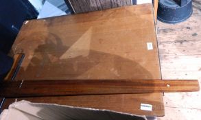An architects T-square and board,