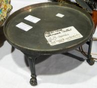 Hammered pewter cake stand with curved stretchers,