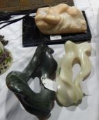 Alabaster sculpture of reclining female in foetal position with hair fanned out around her head,