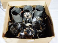 A collection of pewter goblets, hairbrush, teapot, etc.