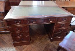 A modern mahogany pedestal desk with inset leather writing surface,