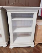 A white painted open bookcase