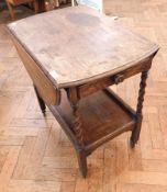 A mid-20th century oak oval drop flap top tea trolley, on spiral supports with undershelf,