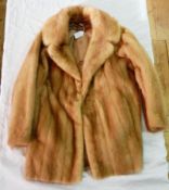 A pale mink jacket together with extra pieces