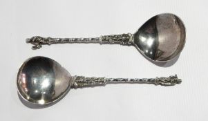 A pair of continental apostle spoons with spiral handles and figure finials,