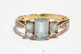 Blue and white stone dress ring set three aquamarine-coloured stones