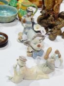 Three Lladro ceramic clown figures and heads