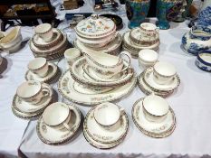 A Wedgwood china tea service with floral decoration together with a part dinner service 