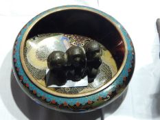 Oriental cloisonne enamel bowl of oblate form with central dragon and a bronzed metal figure group