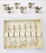 Set of six white metal liqueur cups raised on a circular foot,
