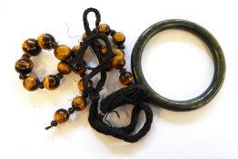 Tiger's eye bead necklace and dark green jade bangle