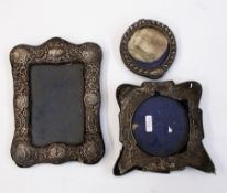 Three silver photograph frames,