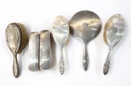 1920's lady's silver-backed dressing table set of six pieces including pair clothes brushes,