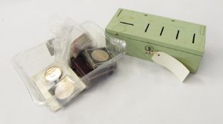 Collection of five shillings and other British coins in a money tin